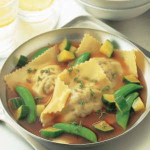 Mushroom ravioli in herb jus
