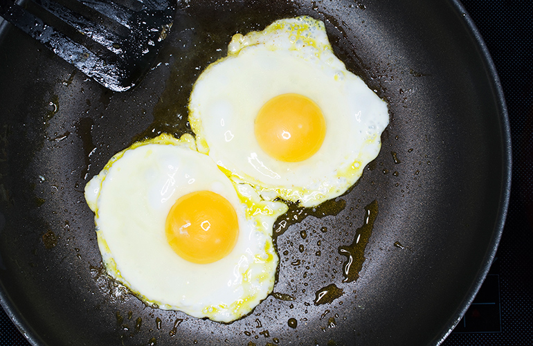 Not using enough fat when frying eggs
