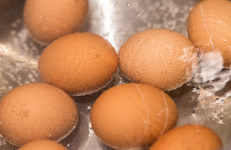 Starting hard-boiled eggs in boiling water