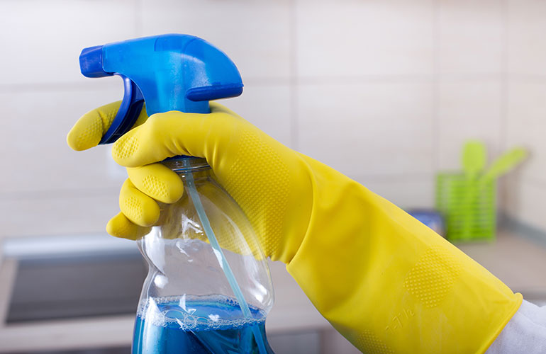 Spraying disinfectant and wiping it up immediately