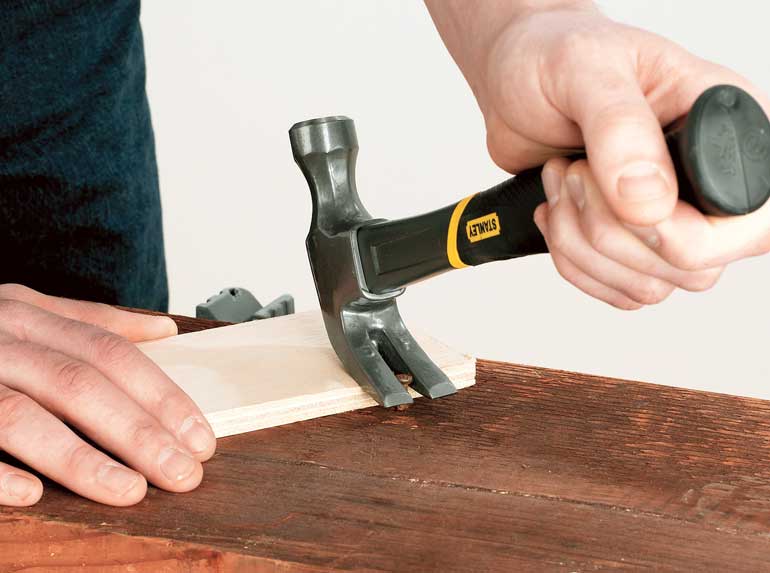 Pull nails out gently