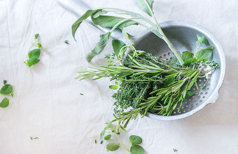 Strip herbs with a colander