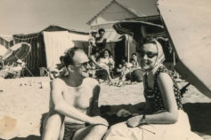 black and white image of couple on beach in 1950s