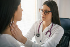 doctor checking patient