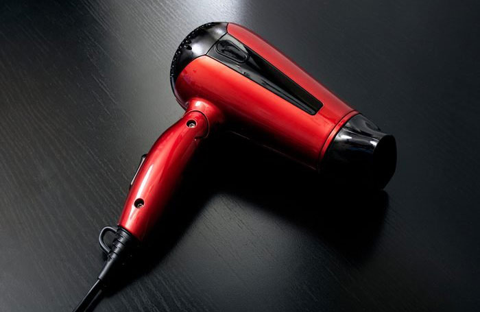 Use a hair dryer to get wrinkles out of clothes