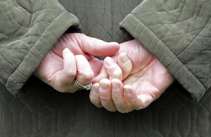 Twisting her wedding ring