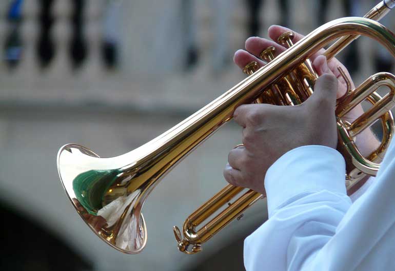 Play a wind instrument or sing