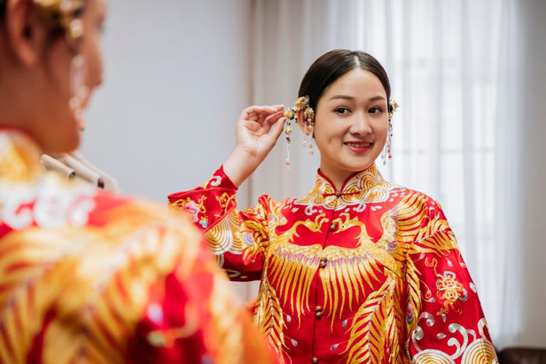 Wearing a red wedding dress