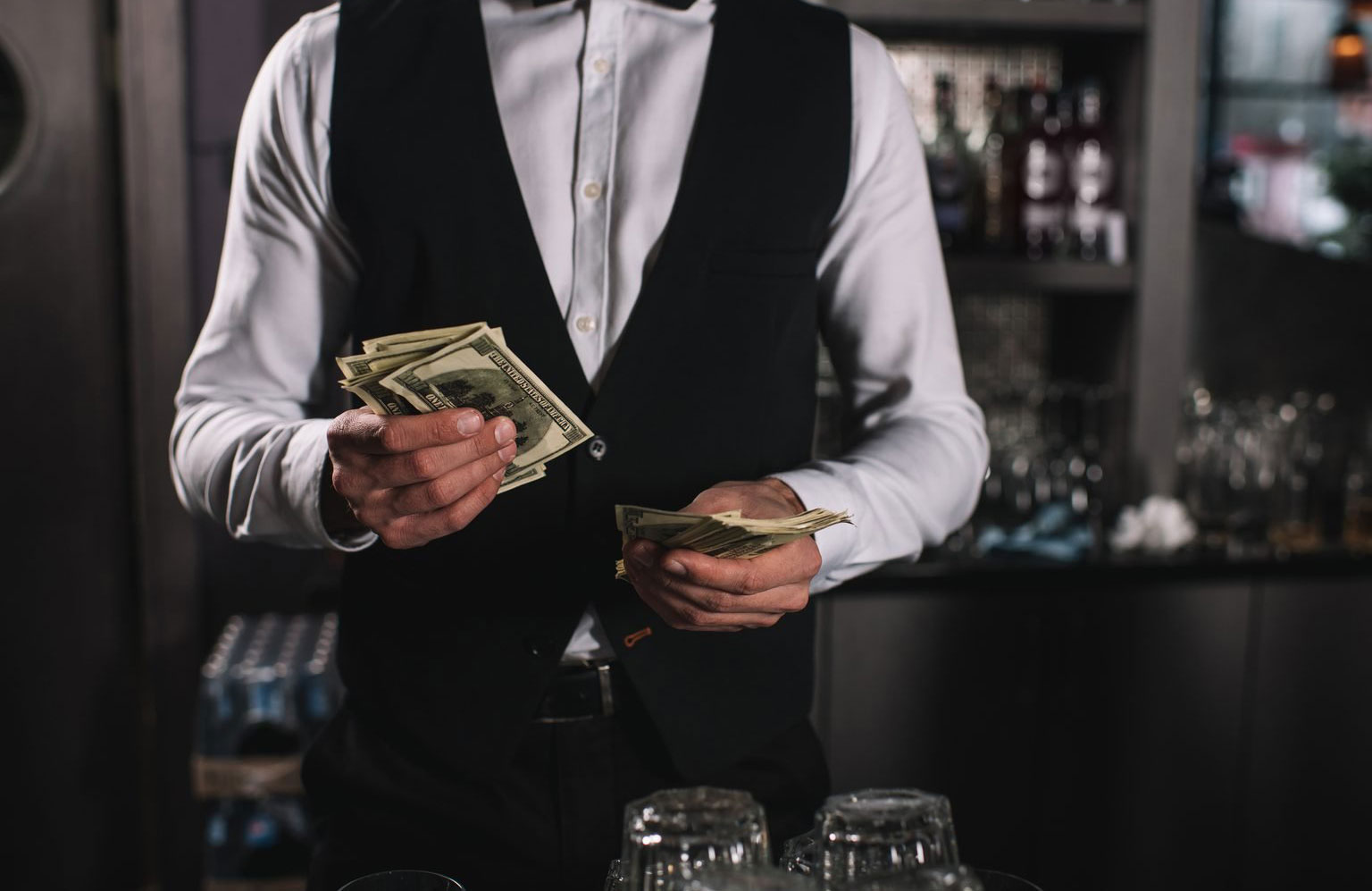 Handing them a wad of cash