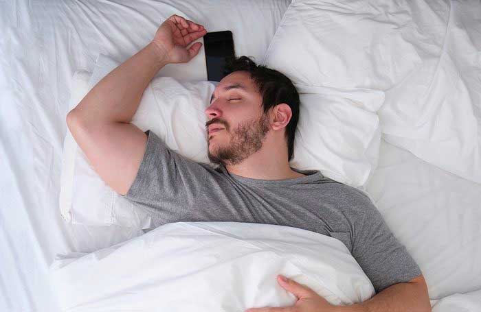 You keep your phone in your bed or under your pillow