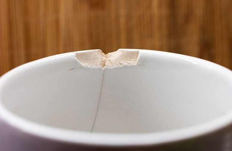 Chipped plates, bowls, mugs