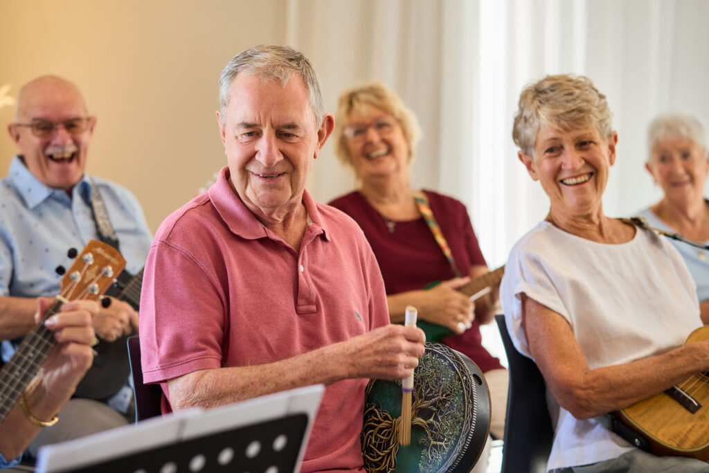 A group of seniors playing musical instruments at SummerSet Retirement Village