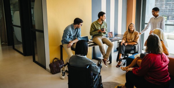 A group of university students collaborating and discussing a project