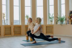 A senior couple practising yoga together